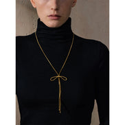 Collier long nœud papillon plaqué or véritable