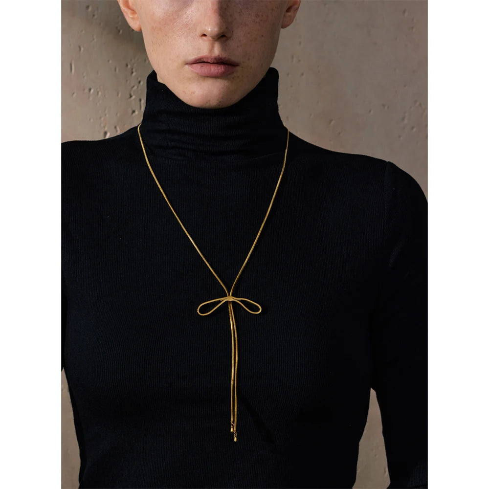 Collier long nœud papillon plaqué or véritable